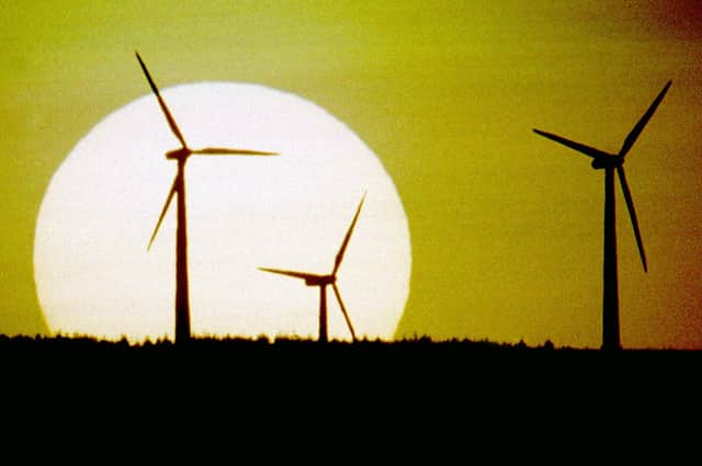 The sun sets behind Scotland's first wind farm on Hagshaw Hill near Douglas in Lanarkshire. The 26 turbine first produced electricity in 1995 and was extended to 46 turbines in 2008. It is operated by ScottishPower Renewables.