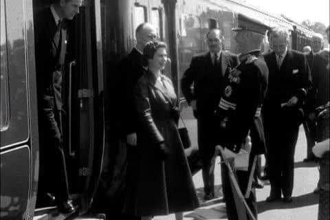The Queen and Prince Philip disembark at Lanark station and are greeted by the Lord Lieutenant.
