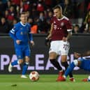 Rangers captain James Tavernier slides in to challenge Sparta Prague's Lukas Haraslin during the Europa League match at the Letna Stadium. (Photo by MICHAL CIZEK/AFP via Getty Images)