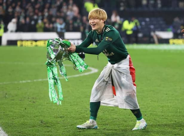 <p>Celtic’s Kyogo Furuhashi celebrates with the Premier Sports Cup Trophy after scoring a double. (Photo by Craig Williamson / SNS Group)</p>