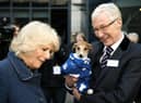 File photo dated 12/12/12  the Queen Consort, then the Duchess of Cornwall, with television presenter Paul O'Grady during her visit to Battersea Dogs & Cats Home in London.