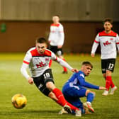 Cyde's Jack Thomson, on loan from Rangers, gets away from Connor Smith of Cove Rangers