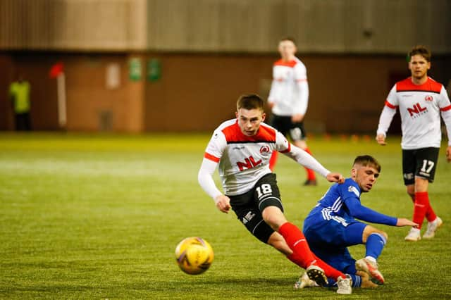 Cyde's Jack Thomson, on loan from Rangers, gets away from Connor Smith of Cove Rangers