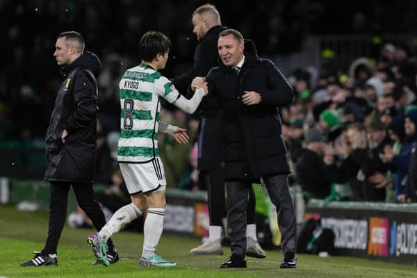 Kyogo Furuhashi is warmly embraced by his Celtic manager Brendan Rodgers