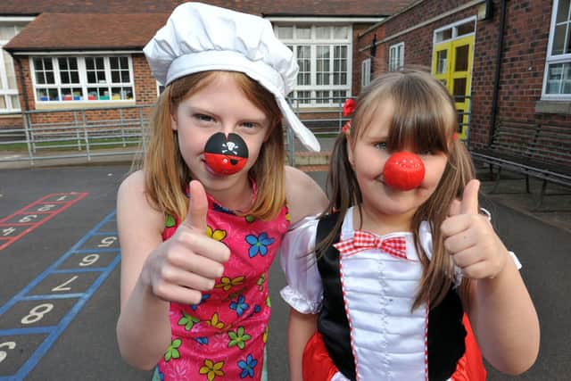 Ryton Park Primary School pupils Chloe Gee, aged 10 with Porscha Keeling, six.