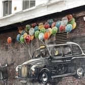 The World’s Most Economical Taxi – Painted by Rogue Oner, located on Mitchell Street