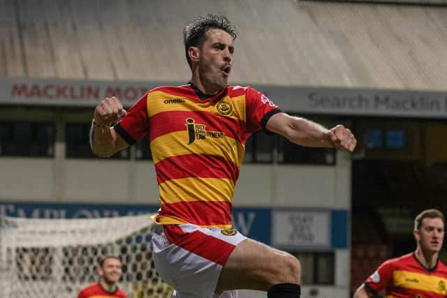 Brian Graham celebrates his late winner for Partick Thistle against Queen's Park.