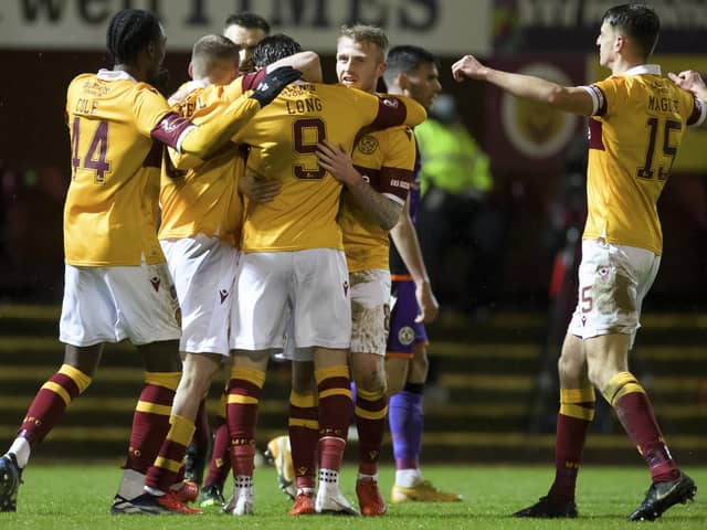 Christopher Long of Motherwell celebrating scoring his side's second goal against Dundee United. Photo: Steve Welsh