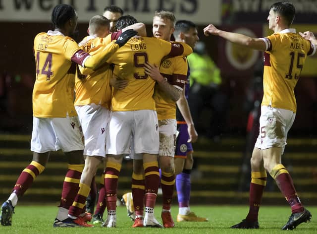 Christopher Long of Motherwell celebrating scoring his side's second goal against Dundee United. Photo: Steve Welsh