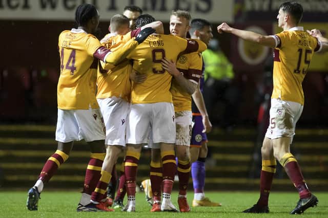 Christopher Long of Motherwell celebrating scoring his side's second goal against Dundee United. Photo: Steve Welsh