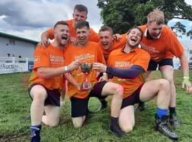 Carluke Young Farmers men celebrate with trophy
