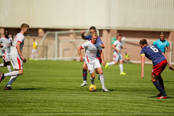 Clyde's Aaron Splaine tries to find a way through the Kilmarnock defence (pic: Craig Black Photography)