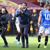 Rangers manager Giovanni van Bronckhorst takes the acclaim of the Rangers fans at full time.