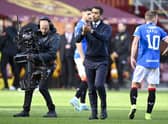 Rangers manager Giovanni van Bronckhorst takes the acclaim of the Rangers fans at full time.