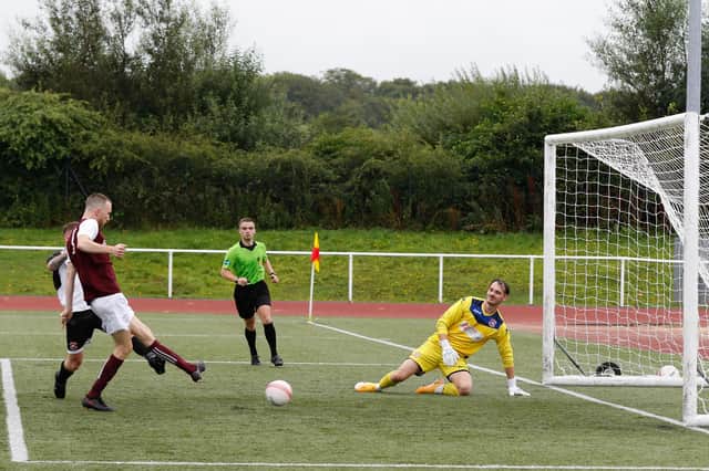 Carluke Rovers' Dylan Dailly completes his hat-trick after initial penalty was saved (Pic by Kevin Ramage)