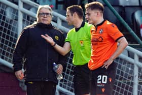 Partick manager Ian McCall speaks with referee Steven McLean after the incident involving Brian Graham