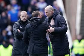 Rangers manager Philippe Clement (right) embraces Celtic manager Brendan Rodgers following the cinch Premiership match at Ibrox Stadium. 