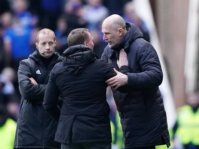 Rangers manager Philippe Clement (right) embraces Celtic manager Brendan Rodgers