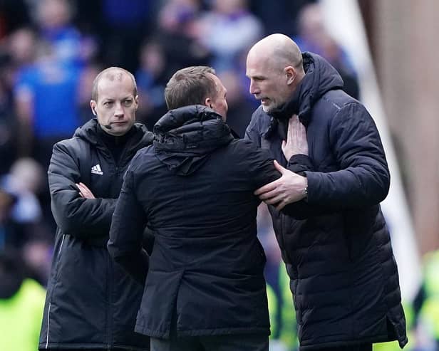 Rangers manager Philippe Clement (right) embraces Celtic manager Brendan Rodgers
