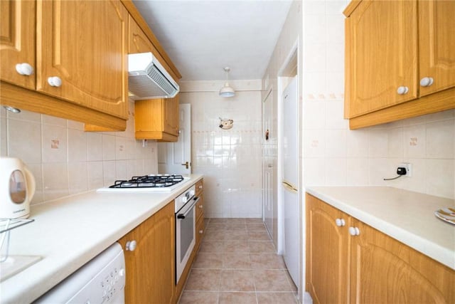 The kitchen has a gas hob and electric oven.