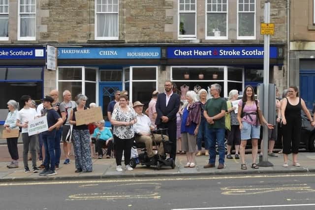 People came out in force all along the route last year to show their support for the service, pictured here at a protect in Biggar.