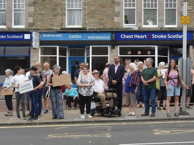 People came out in force all along the route last year to show their support for the service, pictured here at a protect in Biggar.