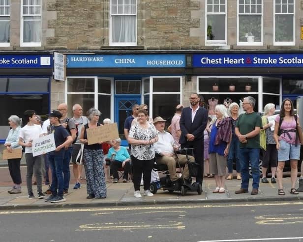 People came out in force all along the route last year to show their support for the service, pictured here at a protect in Biggar.