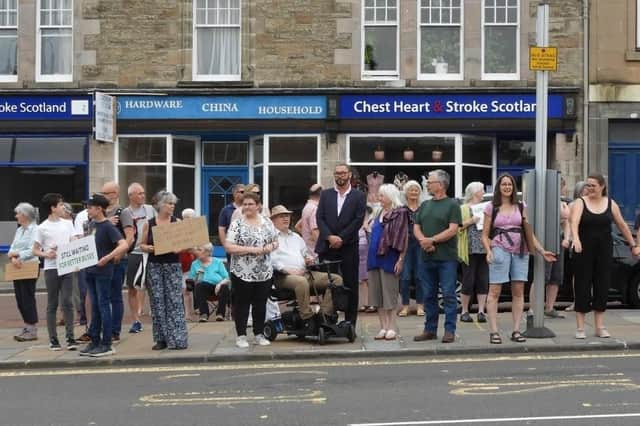 People came out in force all along the route last year to show their support for the service, pictured here at a protect in Biggar.