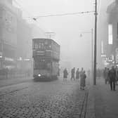 Fog in Argyle Street at lunchtime - Shop signs lit up, 1950s.