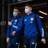 Motherwell right-back Stephen O'Donnell (left) and Hibs striker Kevin Nisbet depart the Scotland team hotel ahead of the flight to Austria for last month’s World Cup qualifier. (Photo by Craig Foy / SNS Group)