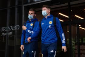 Motherwell right-back Stephen O'Donnell (left) and Hibs striker Kevin Nisbet depart the Scotland team hotel ahead of the flight to Austria for last month’s World Cup qualifier. (Photo by Craig Foy / SNS Group)