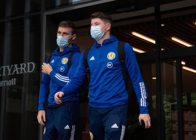 Motherwell right-back Stephen O'Donnell (left) and Hibs striker Kevin Nisbet depart the Scotland team hotel ahead of the flight to Austria for last month’s World Cup qualifier. (Photo by Craig Foy / SNS Group)