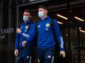Motherwell right-back Stephen O'Donnell (left) and Hibs striker Kevin Nisbet depart the Scotland team hotel ahead of the flight to Austria for last month’s World Cup qualifier. (Photo by Craig Foy / SNS Group)