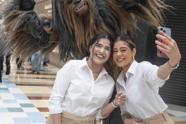 Chewbacca from the Rebel Legion UK group found some new friends in, from left, Fatinah Din, 20, from Glasgow and Sandeela Rayshem, 18, from Glasgow.