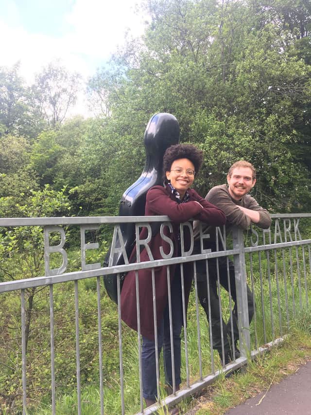 Cellist Simone Seales and actor Raymond Wilson at the site of the famous Bearsden shark fossil
