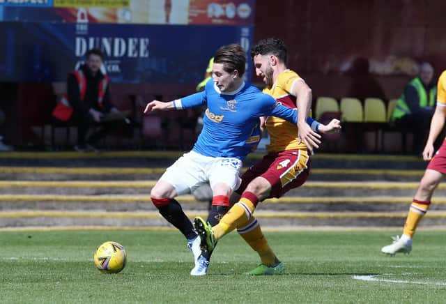 'Well's Ricki Lamie tackles Scott Wright of Rangers