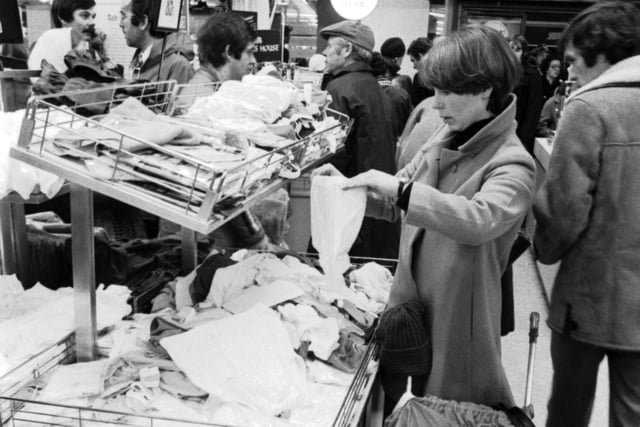 With baby asleep in the buggy, a mother gets a chance to rummage in the Boxing Day sales in Argyle Street in 1978.