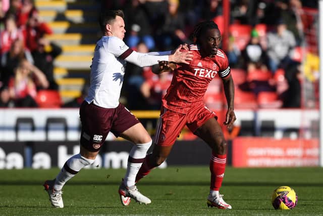 Hearts' Lawrence Shankland (left) - seen here vying with defender Anthony Stewart -  worked hard but missed chances against Aberdeen (Photo by Craig Foy / SNS Group)