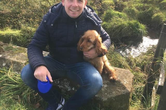 Allan with the family's beloved golden spaniel Penny