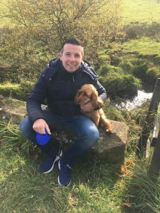 Allan with the family's beloved golden spaniel Penny