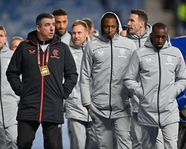 Rangers players walk around the pitch ahead of the UEFA Europa League Group A football match between Rangers and Sparta Prague. (Photo by PAUL ELLIS/POOL/AFP via Getty Images)