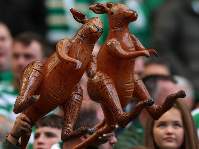 Celtic fans wave inflatable kangaroos before the game.