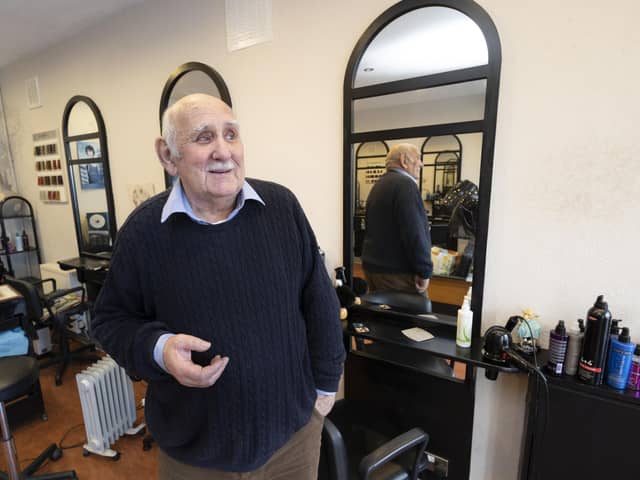 Derek Edward McCulloch at his salon Derek Edward in Strathblane, Stirling.
Derek is retiring after 47 years in the village.

HAIR TODAY……..GONE TOMORROW!
It’s hard to imagine the village without him…….but after 47 years Derek Edward has hung up his scissors and closed his familiar hairdressing salon in Strathblane.
Derek – full name Derek Edward McCulloch – originally hailed from Birmingham and trained there with top hairstylists like Michael Heely. For a while he mixed with the best in UK hair artistry circles, including London’s Mayfair, before moving north with wife Julia and their two sons – first to Bearsden in 1963 then out to Strathblane in 1975.
One of the village’s best-known characters, Derek has still managed to keep some secrets about himself: for example he’s been a top Elvis impersonator. And he met The Beatles when they came to Birmingham in 1962, though history does not record whether he cut their famous mops!
In retirement he now has five grandsons to keep him busy – and his scissors still flying.

Photograph by Martin Shields 
Tel 07572 457000
www.martinshields.com
© Martin Shields
