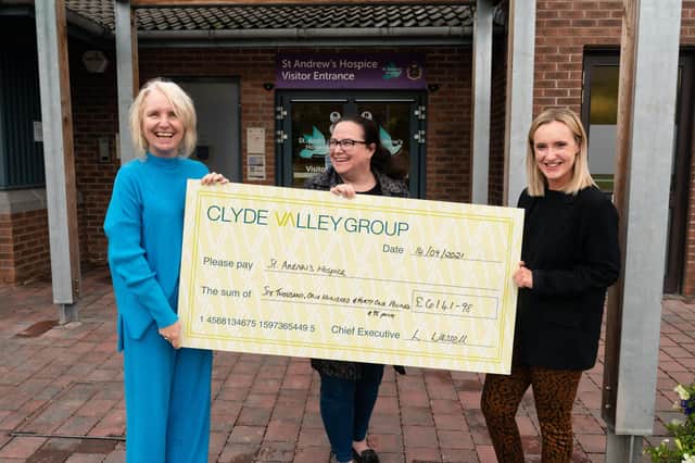 Lorrett McCutcheon (left) community fundraiser for St Andrew's Hospice receiving a donation from Carol Cunningham (centre) and Amy Robertson (right) from CVHA