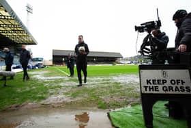 Referee Don Robertson calls the Dundee v Rangers match off during a secondary pitch inspection at Dens Park.