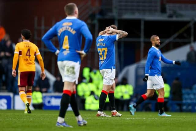 Rangers midfielder Scott Arfield holds his head in despair at full-time after the Scottish champions dropped two points in a 2-2 draw against Motherwell at Ibrox. (Photo by Craig Williamson / SNS Group)