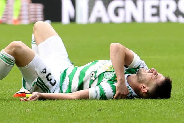 Greg Taylor lies on the ground in pain during Celtic's 3-0 win over Ross County. Picture: SNS