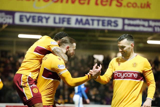 Watt congratulates van Veen on his goal