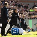 Rangers manager Giovanni van Bronckhorst complains about Hearts midfielder Cammy Devlin's tackle on Rabbi Matondo.