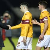 An equaliser by Tony Watt (centre) earned a point for Motherwell at St Johnstone (Library pic)